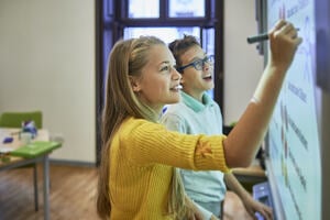 Image of girl writing on a whiteboard