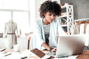 a business woman using a laptop